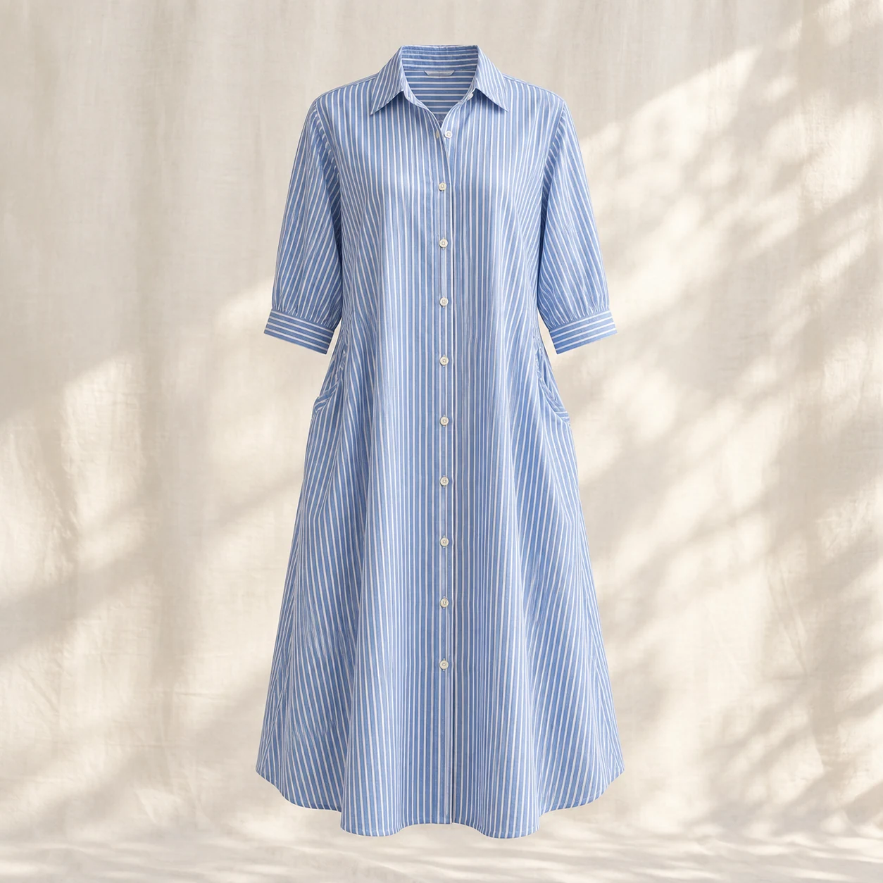 Daylight Stripe Dress in blue stripe, clothing product photograph